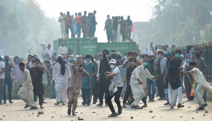 Supporters of jailed former prime minister Imran Khan’s party, Pakistan Tehreek-e-Insaf (PTI) throw stones during an anti-government rally in Islamabad on October 5, 2024. — Reuters