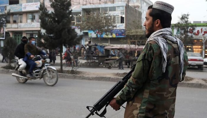 A Taliban fighter stands guard at the site of a blast in Kabul, Afghanistan, November 17, 2021. — Reuters