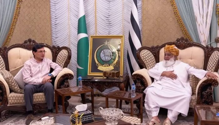 PTI Chairman Barrister Gohar (left) meets JUI-F chief Maulana Fazlur Rehman in this undated image. — Screengrab via Facebook/@juipakofficial