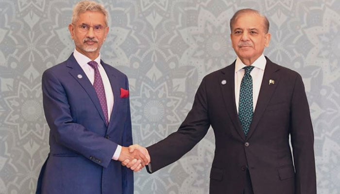 PM Shehbaz Sharif (right) shakes hands with Indian FM Subrahmanyam Jaishankar as the latter arrived at the Jinnah Convention Centre in Islamabad on October 16, 2024. — X/@DrSJaishankar