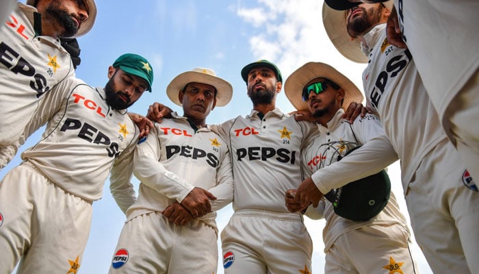 Pakistans players huddled together during Day 2 of the second Test match against England on Oct 16, 2024 at Multan Cricket Stadium. — PCB