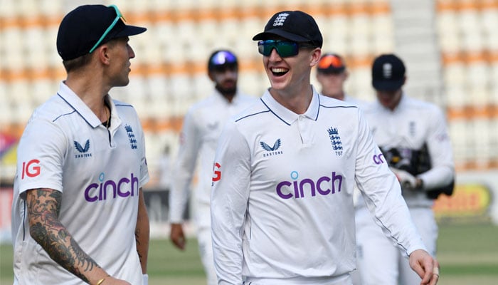 Englands Brydon Carse celebrates with Harry Brook after taking the catch to dismiss Pakistans Noman Ali, off the bowling of Jack Leach during second Test at Multan Cricket Stadium, Multan, Pakistan on October 16, 2024