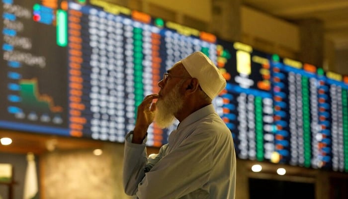 A trader monitors electronic trading board on the floor of Pakistan Stock Exchange. — Reuters/File