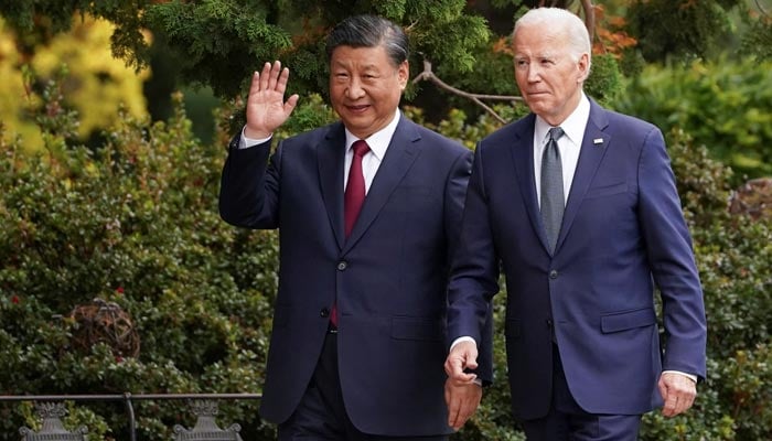 Chinese President Xi Jinping waves as he walks with U.S. President Joe Biden at Filoli estate on the sidelines of the Asia-Pacific Economic Cooperation (APEC) summit, in Woodside, California, US, November 15, 2023. — Reuters