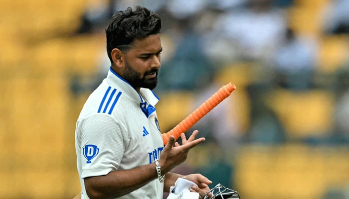 Indias Rishabh Pant walks back to the pavilion after his dismissal during the second day of the first Test cricket match between India and New Zealand at the M. Chinnaswamy Stadium in Bengaluru on October 17, 2024. — AFP