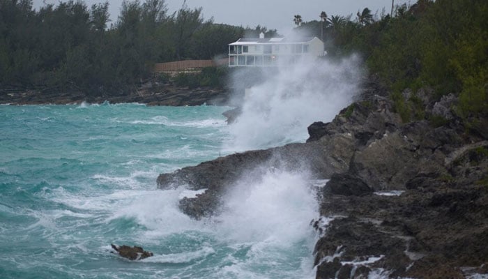 A representative image showing waves crashing onto rocks on a shoreline before a hurricane arrives. — Reuters/File