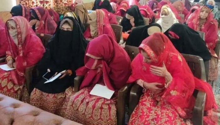 Brides attend a mass-wedding ceremony in this undated photo. — APP/File