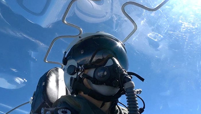 A member of Chinese Peoples Liberation Army (PLA) sits in an aircraft during the Joint Sword-2024B military drills around Taiwan, from an undisclosed location in this screenshot from a handout video released by the PLA Eastern Theatre Command on October 14, 2024. — Reuters