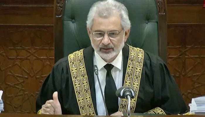 CJP Qazi Faez Isa announces verdict on a petition on October 11, 2023, in this still taken from a video. — State media