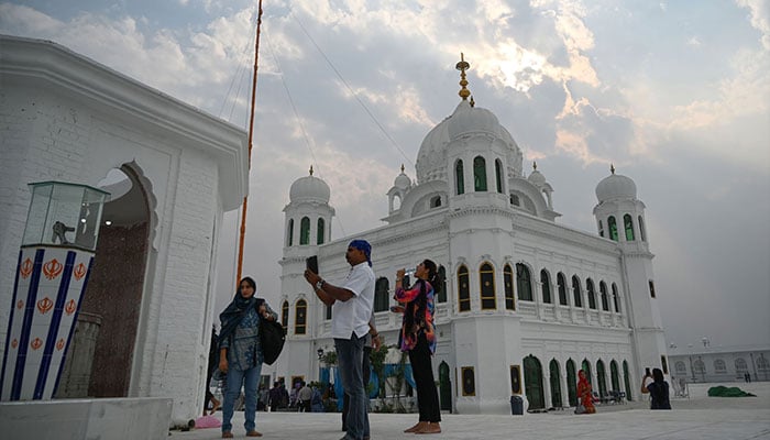 Sikh pilgrims from different countries visit the Shrine of Baba Guru Nanak Dev at the Gurdwara Darbar Sahib, in the Pakistani town of Kartarpur, near the Indian border, on November 6, 2019. — AFP