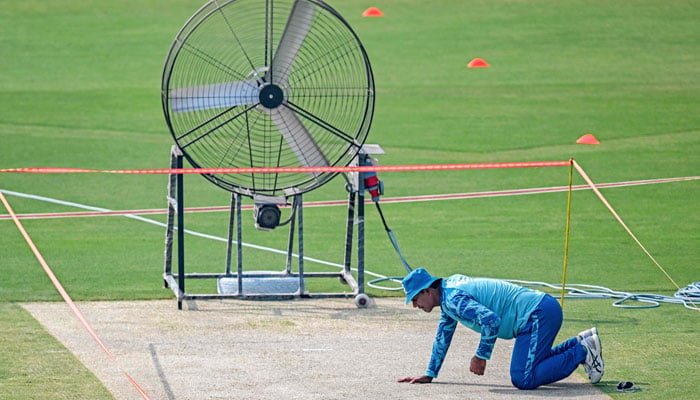 Pakistans Noman Ali inspects the pitch during a practice session ahead of the third and last Test against England at the Rawalpindi Cricket Stadium in Rawalpindi on October 21, 2024. — AFP