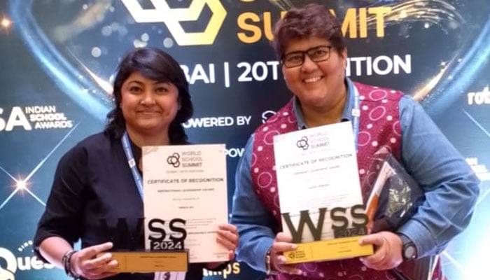 Pakistans Sadia Sheikh (right) and Naila Sheikh pose for a photo at the World School Summit in Dubai. — Reporter