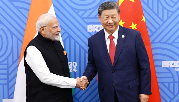 Chinese President Xi Jinping and India Prime Minister Narendra Modi meet on the sidelines of the BRICS summit in Kazan, Russia October 23, 2024. — Reuters