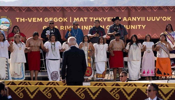 US President Joe Biden watches ceremonial Piipaash dancers at Gila Crossing Community School on October 25, 2024 in Laveen, Arizona. —AFP