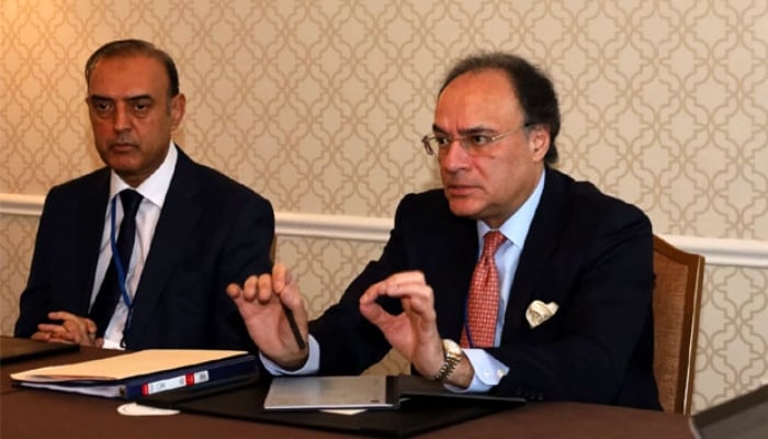 Finance Minister Muhammad Aurangzeb (right) and State Bank of Pakistan Governor Jameel Ahmed in a meeting in Washington, US. —Radio Pakistan/ File