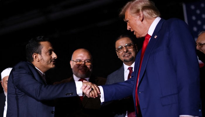 Republican presidential nominee and former US president Donald Trump greets Michigan Muslim community leaders, during a campaign rally in Novi, Michigan, US on October 26, 2024. — Reuters