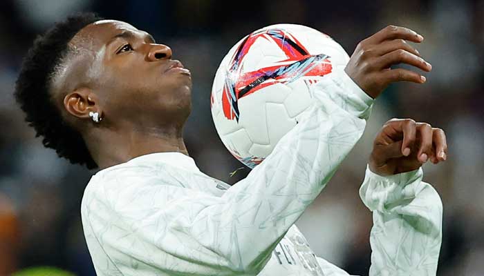 Real Madrid’s Brazilian forward #07 Vinicius Junior warms up before the Spanish league football match between Real Madrid CF and FC Barcelona at the Santiago Bernabeu stadium in Madrid on October 26, 2024. — AFP