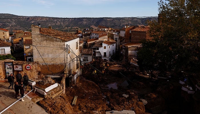 Firefighters work to clear debris after heavy rains caused flooding, in Letur, Spain, October 30, 2024. — Reuters