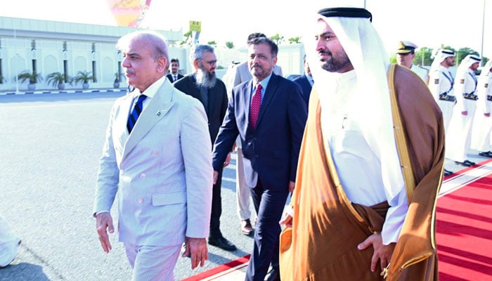 Qatars Minister of State Muhammad bin Abdulaziz Al-Khulaifi (right) receives Prime Minister Shehbaz Sharif at Doha International Airport on October 30, 2024. — X/PTV