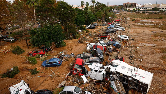 Vehicles are piled up on rail road tracks after heavy rains in Alfafar, in Valencia, Spain, November 1, 2024. — Reuters