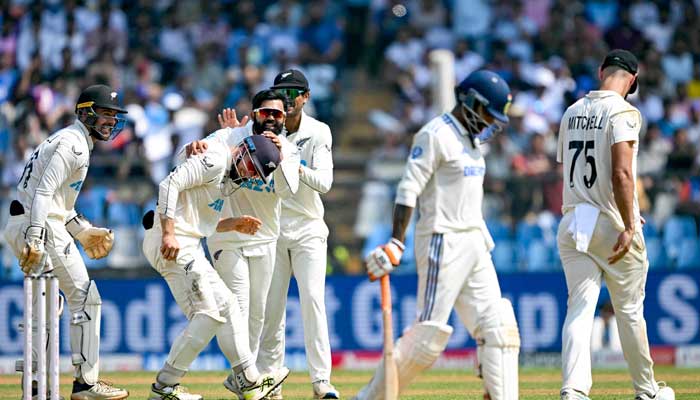 New Zealand players celebrate during the third day of the third and final Test against India at the Wankhede Stadium in Mumbai on November 3, 2024. — AFP