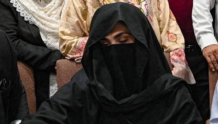 Bushra Bibi, the wife of PTI founder Imran Khan, is seen seated at a registrars office in the Lahore High Court on July 17, 2023. — AFP