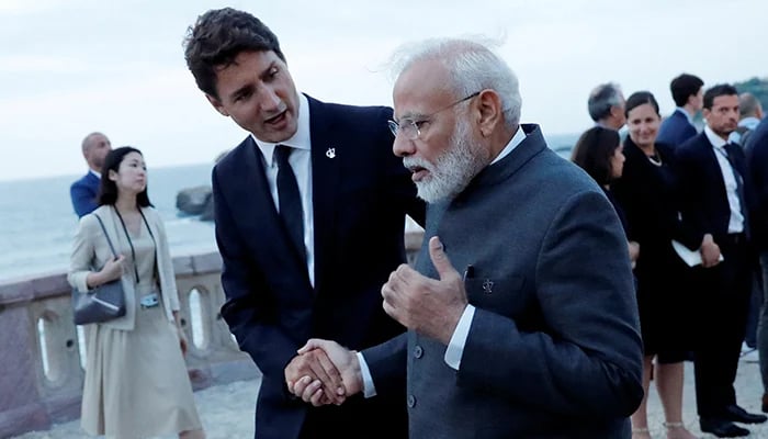 Canadas PM Justin Trudeau shakes hands with Indian PM Narendra Modi after a family photo with invited guests at the G7 summit in Biarritz, France, on August 25, 2019. — Reuters