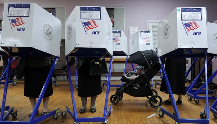 Women from the Hasidic Jewish community vote at a polling center in Brooklyn, New York City. — Reuters