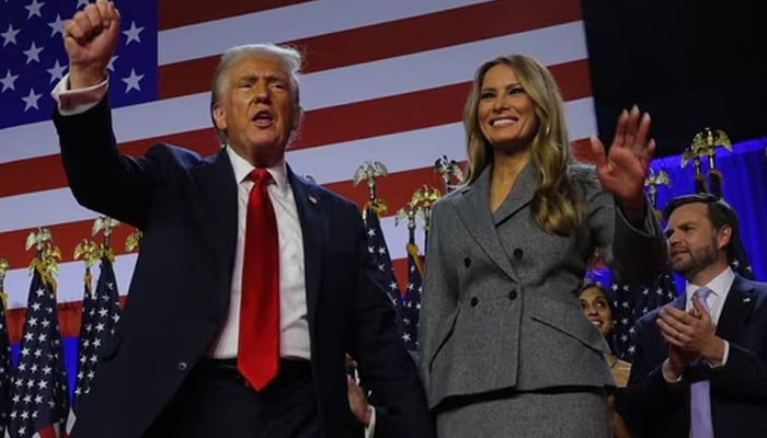 Donald Trump with wife Melania during his speech in Florida. — Reuters