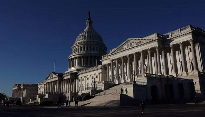 People walk past the US Capitol building in Washington DC, on Jan 11, 2024. — Reuters