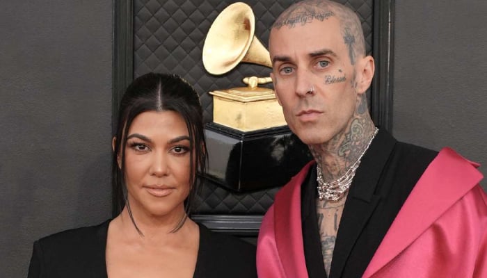 Kourtney Kardashian and Travis Barker dress up as The Addams Family couple