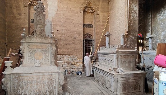 A man stands inside the tomb of the El-Meligy family, prior to its demolition in a historic Cairo cemetery, on November 6, 2024. — AFP