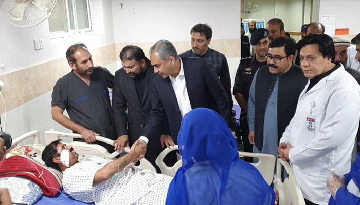 Interior Minister Mohsin Naqvi along with Balochistan Chief Minister Sarfraz Bugti inquiring health of injured person in railway station blast at Civil Hospital, Quetta, November 10, 2024. — PID