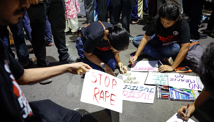 People make posters during a protest condemning the rape and murder of a trainee medic at a government-run hospital, in Kolkata, India, October 15, 2024. — Reuters