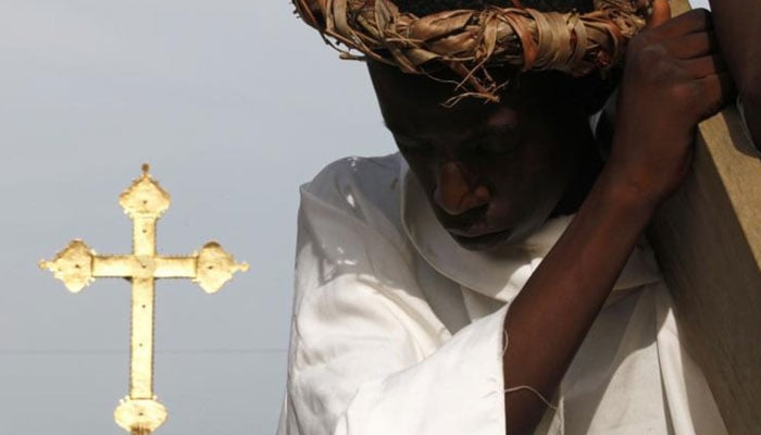 An actor portraying Jesus Christ takes part in a Via Crucis (Way of the Cross) procession during Holy Week at Plateau Dokui, an area of Abidjan, Ivory Coast,March 29, 2013. — Reuters