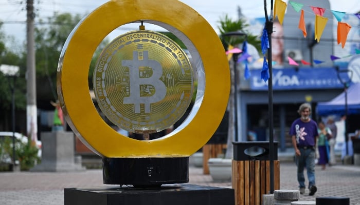 A man walks past a bitcoin monument at Plaza Bitcoin in San Salvador on September 4, 2024. —Reuters