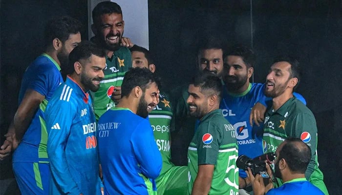 Virat Kohli shares a light moment with Pakistan players after the match was called off, India vs Pakistan, Asia Cup, Pallekele, September 2, 2023. — AFP