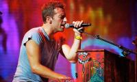 Coldplay's Chris Martin Carries Out 'unusual' Ritual Before Boarding Airplane