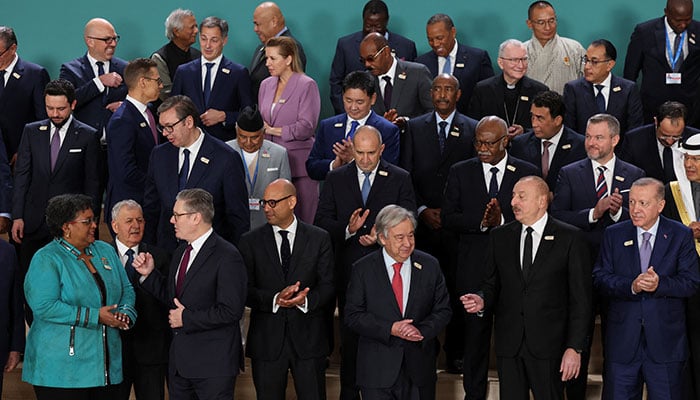 World leaders react as they pose for a group photo at the United Nations climate change conference, known as COP29, in Baku, Azerbaijan November 12, 2024. — Reuters