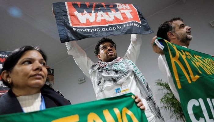 Activists hold up signs at a protest during the United Nations COP29, in Baku, Azerbaijan November 14, 2024. — Reuters