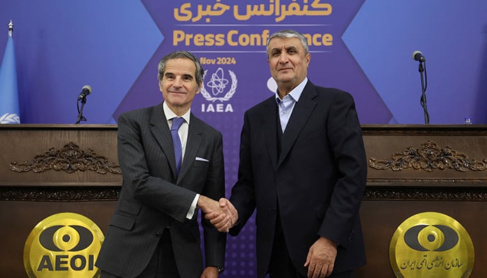 IAEA Director General Rafael Mariano Grossi (left) shakes hands with Head of Irans Atomic Energy Organization Mohammad Eslami during a press conference in Tehran, Iran, November 14, 2024. — Reuters