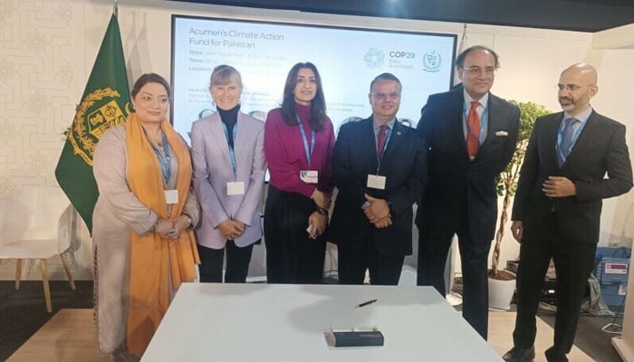 Finance Minister Muhammad Aurangzeb and Coordinator to the Prime Minister for Climate Change Romina Khurshid Alam pose for a photo at an event at the Pakistan Pavilion on the sidelines of the COP29 conference in Baku on November 14. — PID