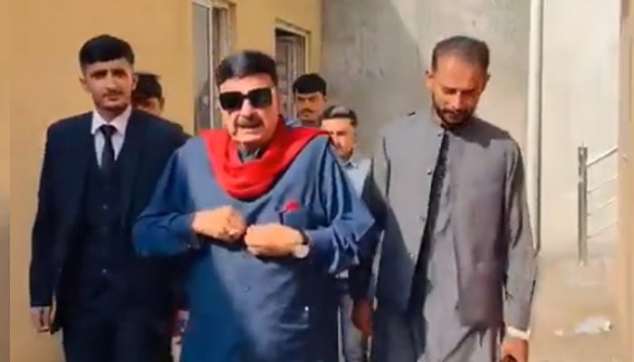 Former interior minister Shiekh Rashid walks out of local court in Islamabad after his acquittal in case pertaining to his remarks on President Asif Ali Zardari on November 15, 2024. — Reporter