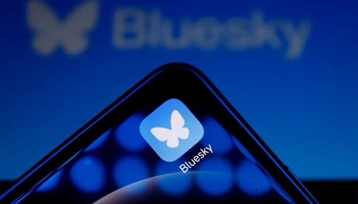 Logo of social media platform Bluesky displayed on a mobile telephone. — AFP/file