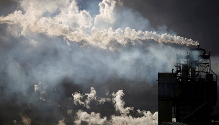 A view shows emissions from the chimneys of Yara France plant in Montoir-de-Bretagne near Saint-Nazaire, France, March 4, 2022. — Reuters