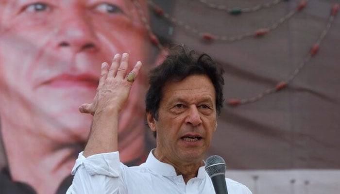 PTI founder Imran Khan gestures while addressing his supporters during a campaign meeting ahead of general elections in Karachi, July 4, 2018. — Reuters