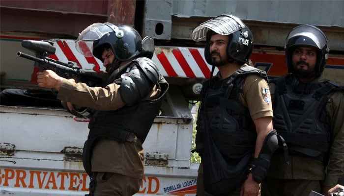 Punjab Police Personnel try to repel protesters during a clash between Police and violent protesters against the arrest of PTI Chief Imran Khan from the premises of Islamabad High Court, at Mall road in Lahore on May 10, 2023. — APP/File