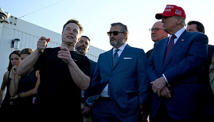 Elon Musk speaks with US President-elect Donald Trump and guests including Donald Trump Jr., Sen. Ted Cruz (R-TX) and Kevin Cramer (R-ND) at a viewing of the launch of the sixth test flight of the SpaceX Starship, in Brownsville, Texas, November 19, 2024. — Reuters