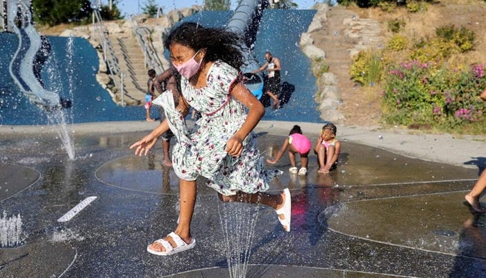 A child plays in a spray park at Jefferson Park during a heat wave in Seattle, Washington, US, June 27, 2021. — Reuters