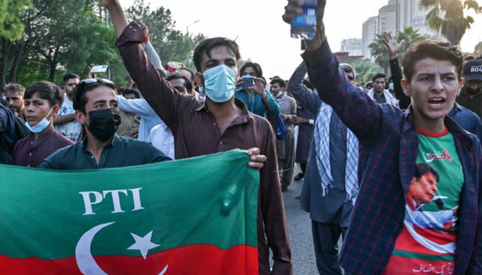 PTI supporters shout slogans during a protest in Islamabad on October 4, 2024. — AFP